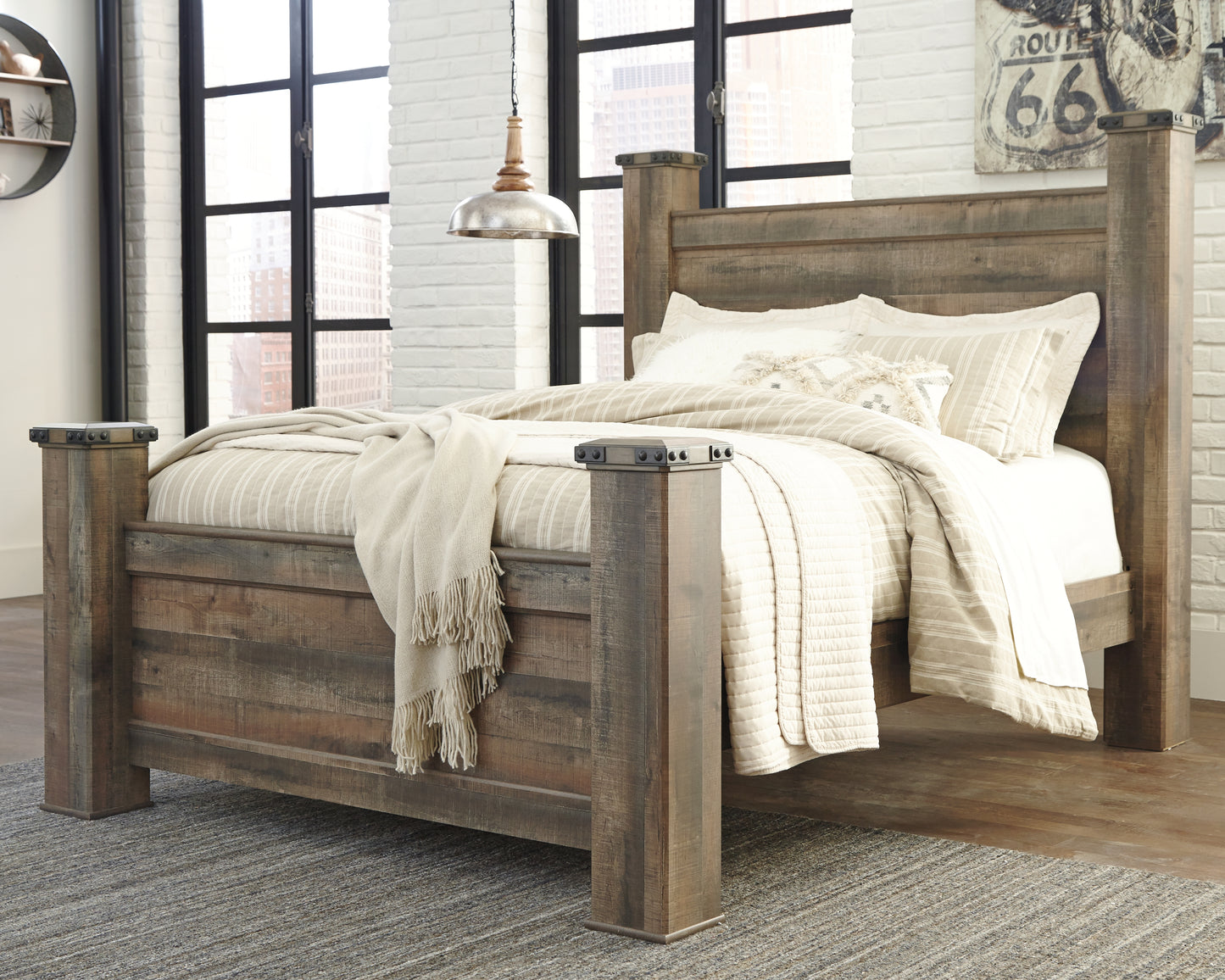 Cassel Furniture Outlet - Ashley Furniture - Trinell Bedroom - Queen Poster Bed / Brown - B446B40