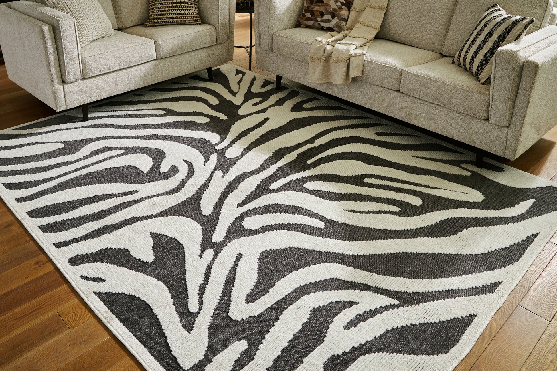 Cassel Furniture Outlet - Ashley Furniture - Thomwith Rug - 8' x 10'2" Washable Rug / Black/Ivory - R406291