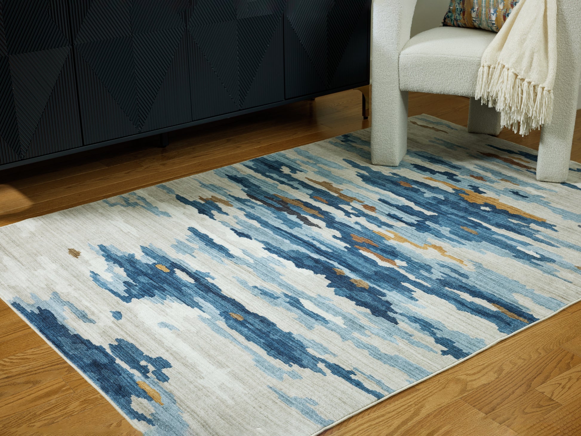 Cassel Furniture Outlet - Ashley Furniture - Vinlett Rug - 5' x 7' Washable Rug / Cream/Blue/Brown - R407042