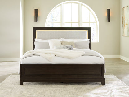 Cassel Furniture Outlet - Ashley Furniture - Neymorton Bedroom - King Upholstered Panel Bed / Dark Grayish Brown - B618B4