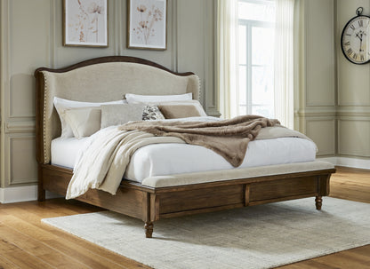 Cassel Furniture Outlet - Ashley Furniture - Sturlayne Bedroom - California King Upholstered Panel Bed / Brown - B787B5