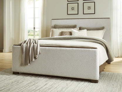 Cassel Furniture Outlet - Ashley Furniture - Radkin Bedroom - Queen Upholstered Panel Bed / Burnished Brown - PCB843B2