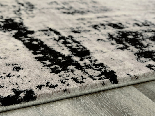 Cassel Furniture Outlet - Ashley Furniture - Zekeman Rug - 5'3" x 7'7" Rug / Black/Cream/Gray - R404922