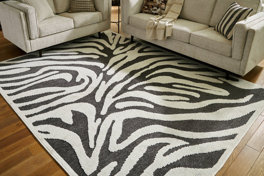Cassel Furniture Outlet - Ashley Furniture - Thomwith Rug - 8' x 10'2" Washable Rug / Black/Ivory - R406291