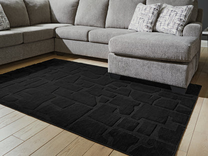 Cassel Furniture Outlet - Ashley Furniture - Gibbswell Rug - Washable 5' x 7' Area Rug / Black - R407462