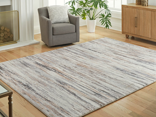 Cassel Furniture Outlet - Ashley Furniture - Nace Rug - 7'6" x 9'6" Area Rug / Gray/Brown/White - R407471