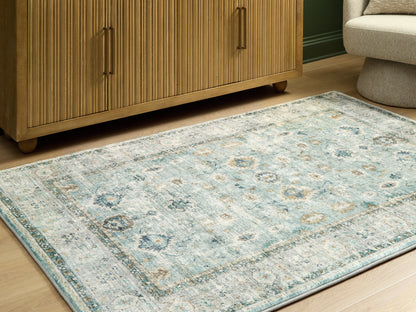 Cassel Furniture Outlet - Ashley Furniture - Ladstoney Rug - 5' x 7' Area Rug / Teal/Beige/Ochre - R407502