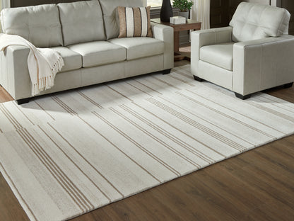 Cassel Furniture Outlet - Ashley Furniture - Gadence Rug - 7'8" x 10' Area Rug / Ivory/Tan - R407641