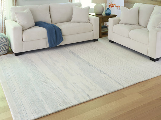 Cassel Furniture Outlet - Ashley Furniture - Genemost Rug - 7'8" x 10' Area Rug / Ivory/Blue - R407841